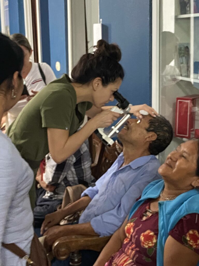 Doctor examining patients eyes