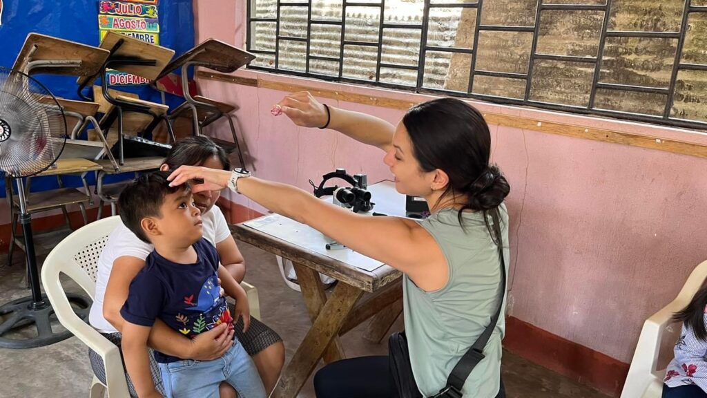 Dr. Amelia Huang with pediatric patient