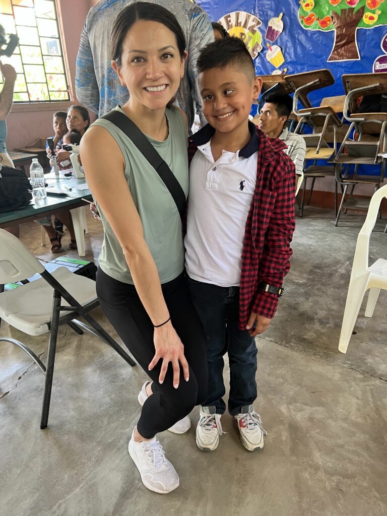 Dr. Amelia Huang with child patient